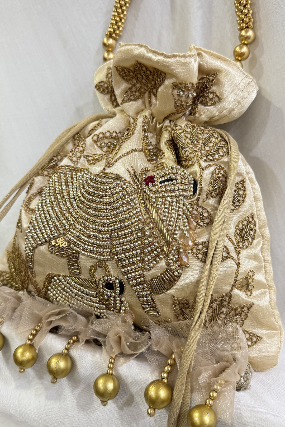 Pichwai Handwork Potli bag with beaded pearl handle - Cream Gold