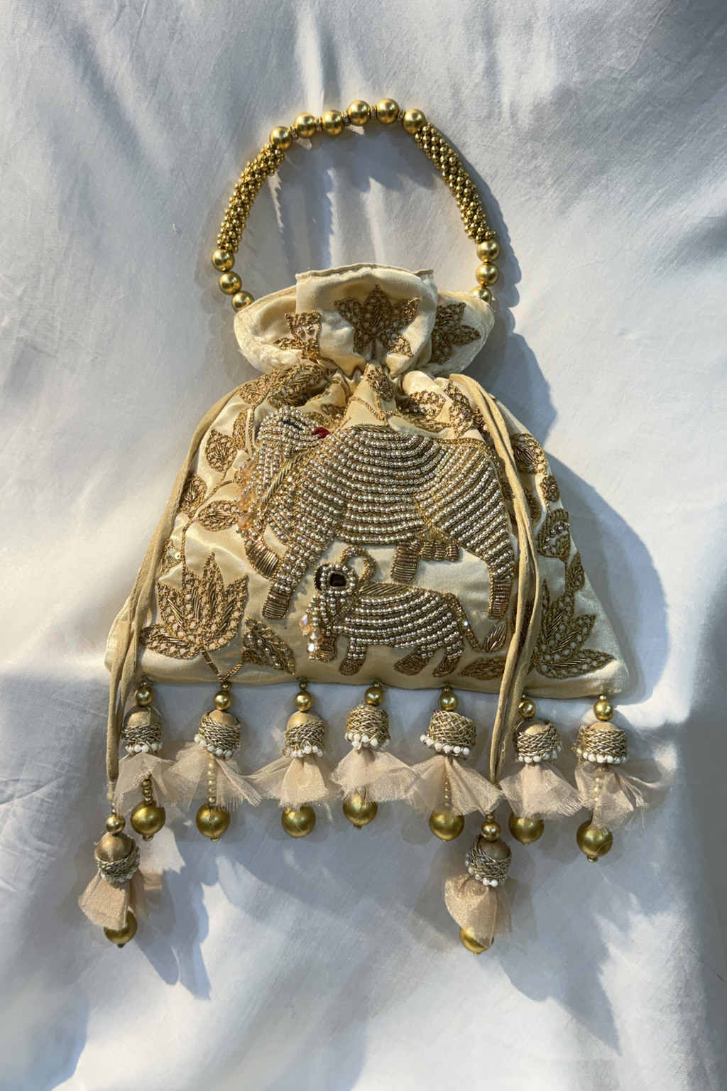 Pichwai Handwork Potli bag with beaded pearl handle - Cream Gold