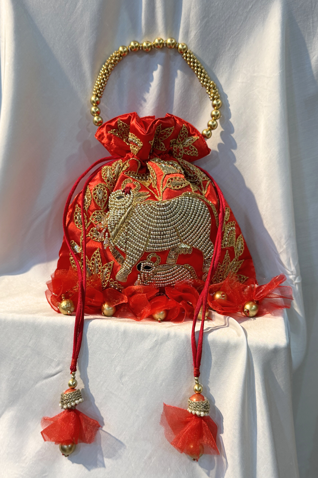 Pichwai Handwork Potli bag with beaded pearl handle - Red